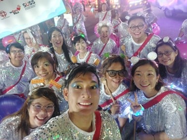 Jordan and his newfound friends at the Chingay Parade