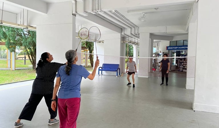 Seniors working up a sweat through an engaging game of modified badminton