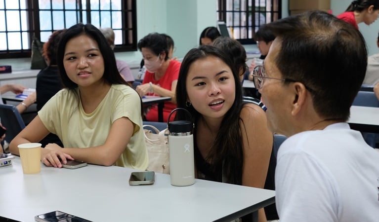 Students in conversation with seniors