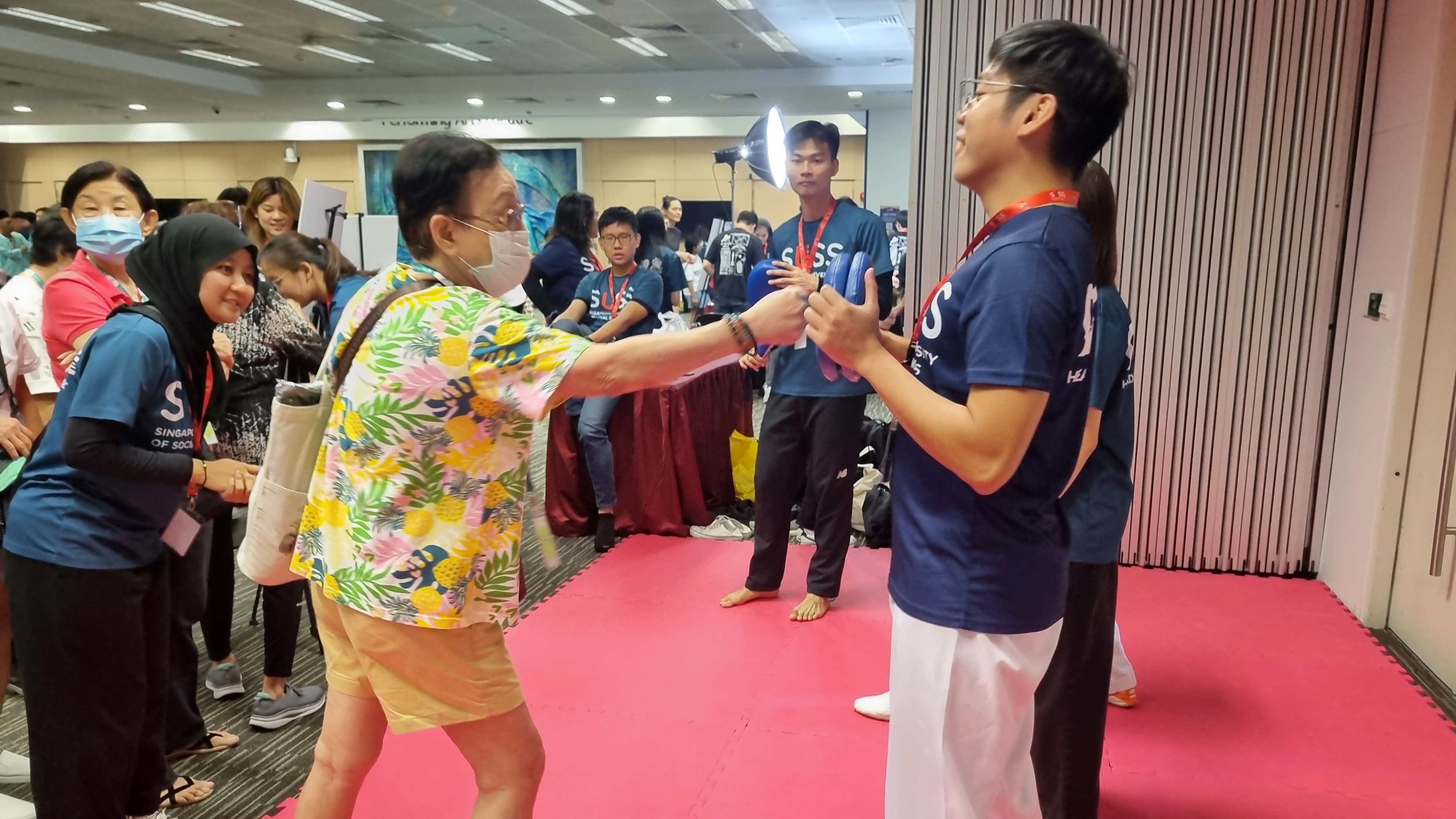 SUSS Taekwondo Competition Group members facilitated an inclusive martial arts activity that promoted physical fitness and intergenerational bonding.