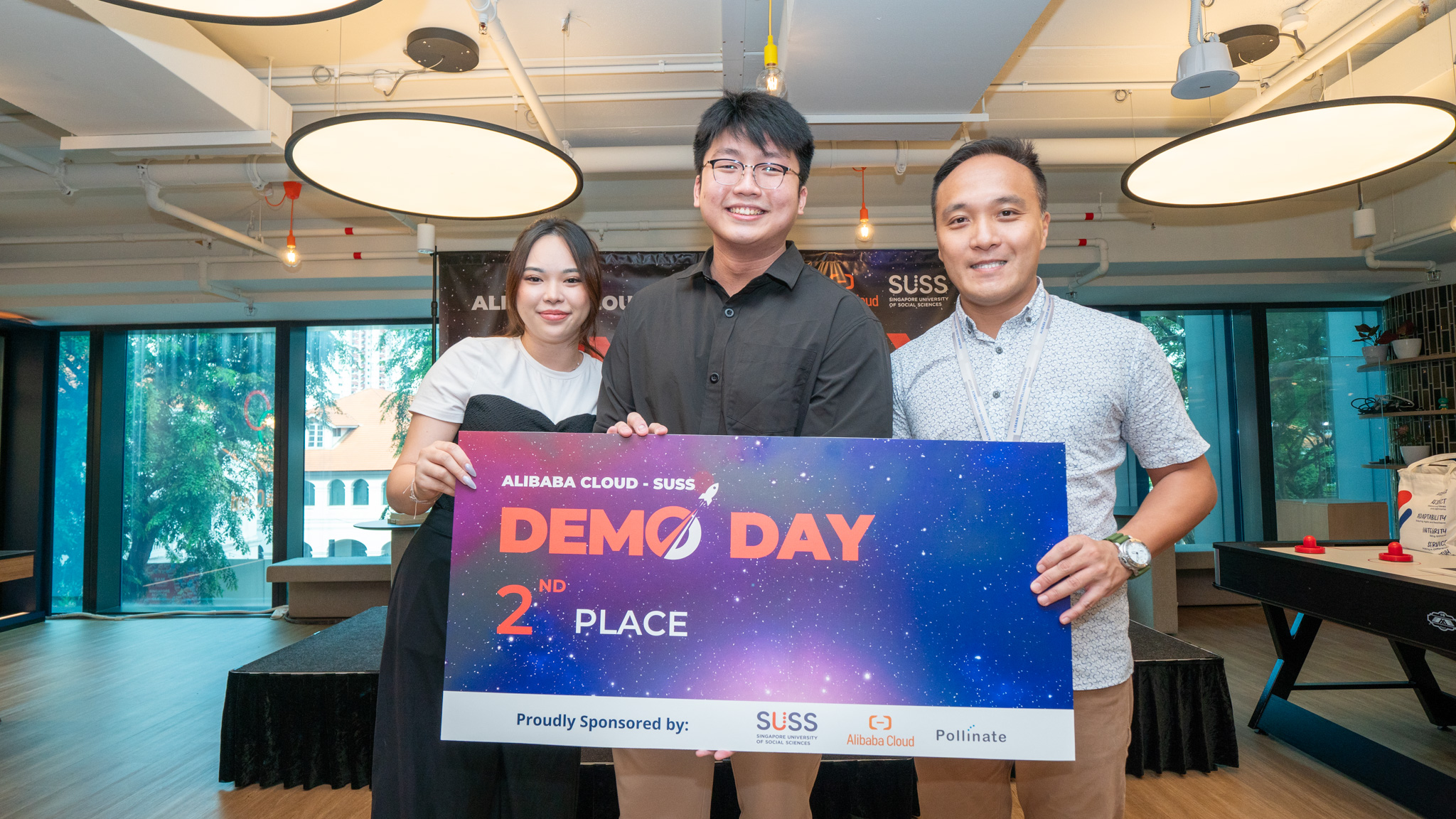 First runner-up of Alibaba Cloud-SUSS Demo Day, Surety, graciously accepts their prize alongside Chris Tan, Director of Sales and Business Development at Alibaba Cloud, radiating pride and excitement