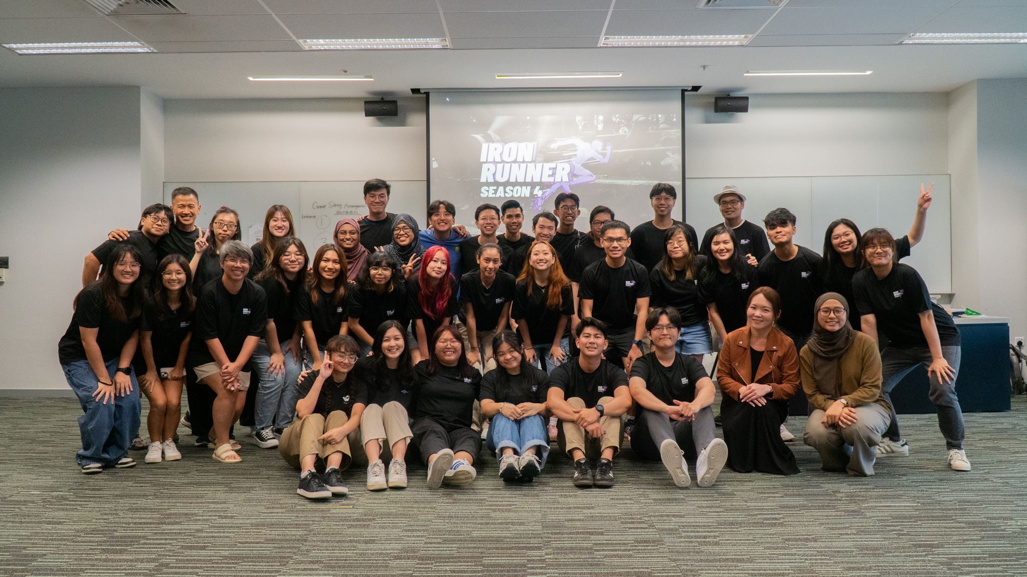 Participants and organisers of the Iron Runner Season 4 posing cheerfully at the Closing Ceremony