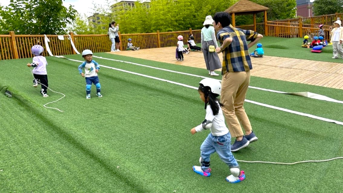 Outdoor activities at Shanghai University Experimental Kindergarten encourage risk-taking and exploration within a safe, yet unrestricted environment, fostering creat
