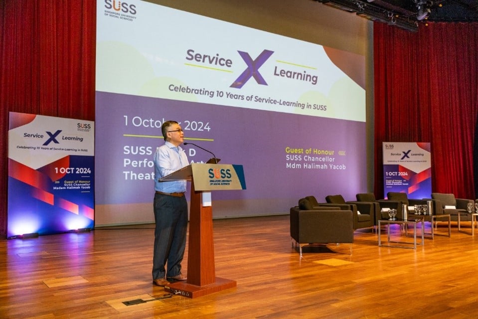 Prof. Goh welcoming the attendees to ”10 Years of Service-Learning in SUSS” celebrations