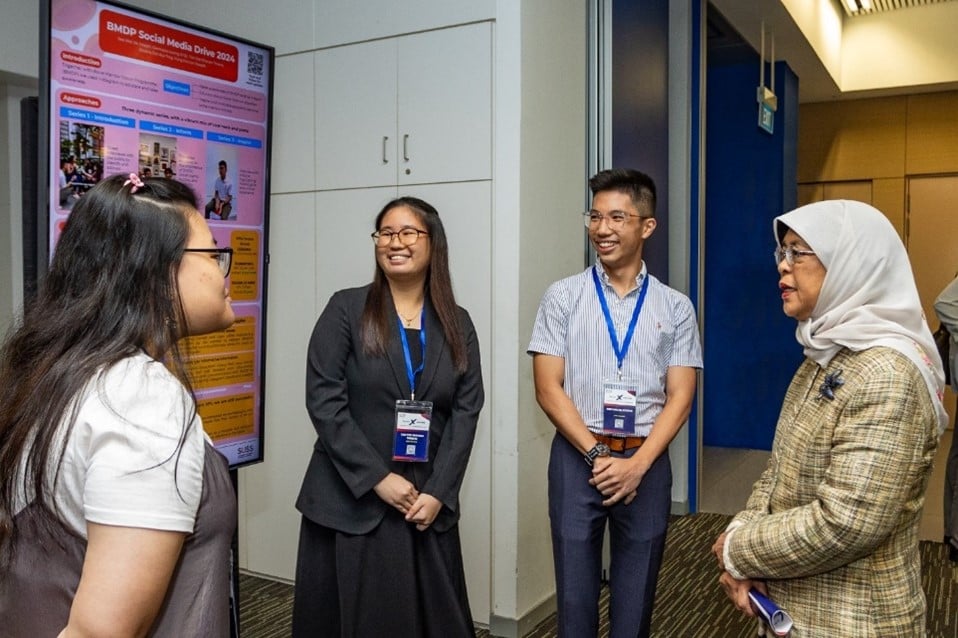 Students sharing about their Service-Learning initiative with Mdm Halimah