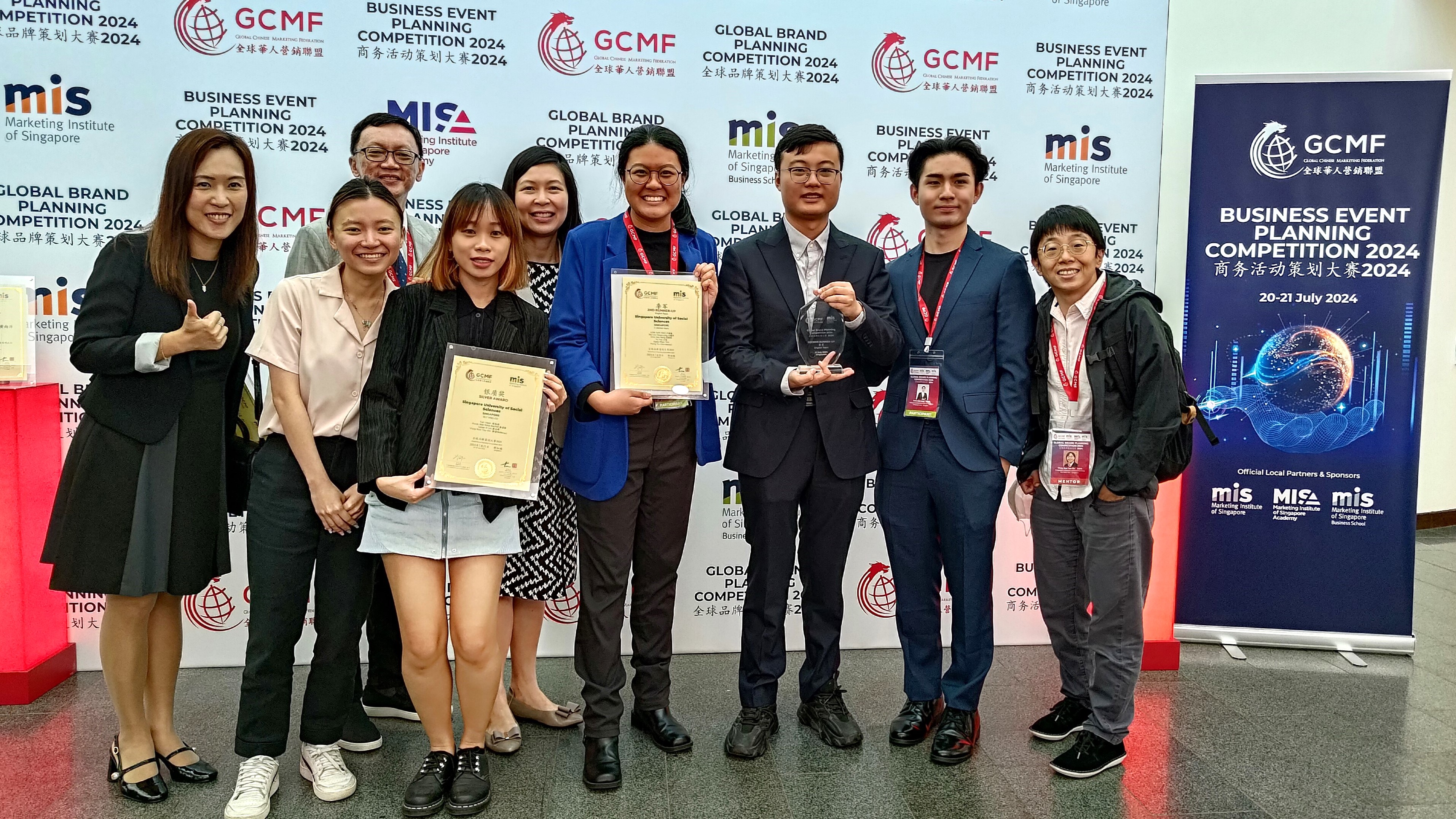 SUSS Marketing students and faculty members cheerfully gather at the GBPC 2024 Award Ceremony (From left to right Associate Professor Ada Wong, Tan Yi Bin, Associate Professor Jimmy Wong,