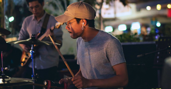 Liew Kai Sheng Kenji, SUSS Counselling graduate and MIG alumnus, immersed in the beat.