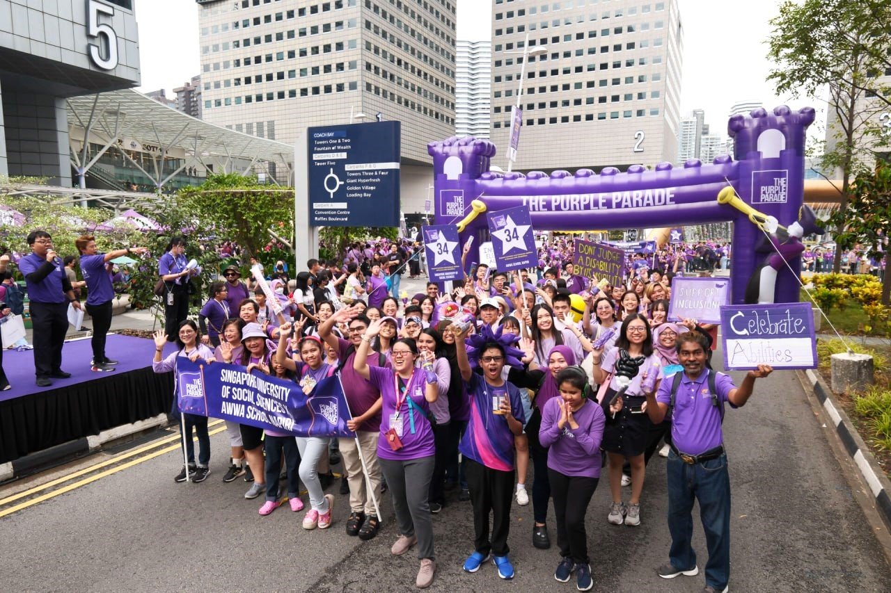 SUSS X AWWA School @Napiri marching together at The Purple Parade