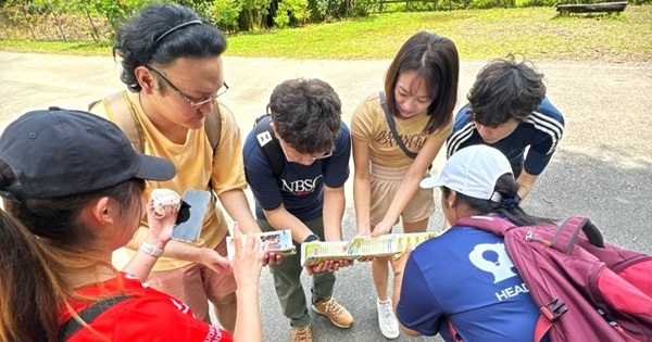 Participants focus on the task at hand, engaging in teamwork to solve the clues around Pulau Ubin together.